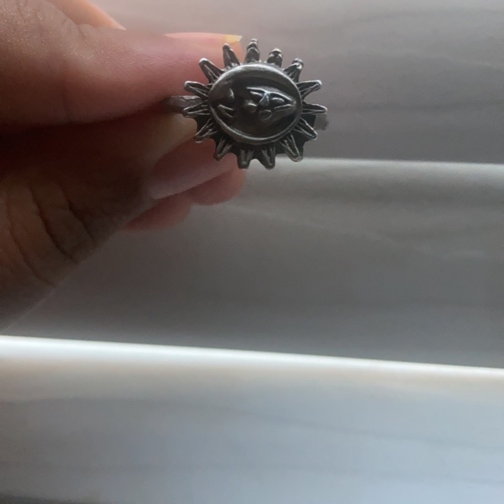 Faces in the sun ring